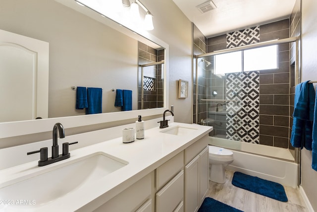 29771 N 67th St, Scottsdale, AZ 85266 - full bath with toilet, a sink, bath / shower combo with glass door, and visible vents