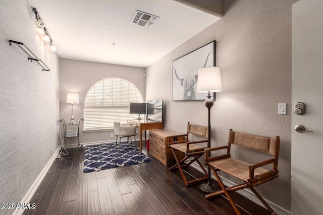 29771 N 67th St, Scottsdale, AZ 85266 - living area featuring visible vents, track lighting, baseboards, wood finished floors, and a textured wall