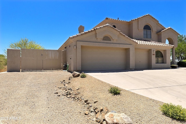 29771 N 67th St, Scottsdale, AZ 85266 - view of front of home with stucco siding, a garage, a tiled roof, and concrete driveway