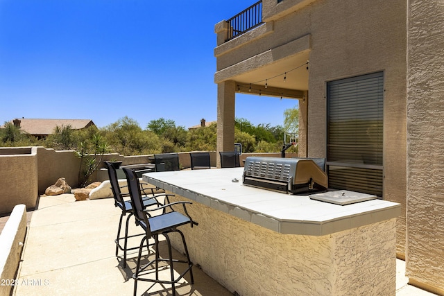 29771 N 67th St, Scottsdale, AZ 85266 - view of patio with fence, a grill, a balcony, outdoor wet bar, and area for grilling