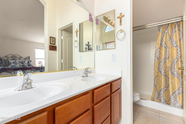 bathroom with tile patterned flooring, vanity, a shower with shower curtain, and toilet