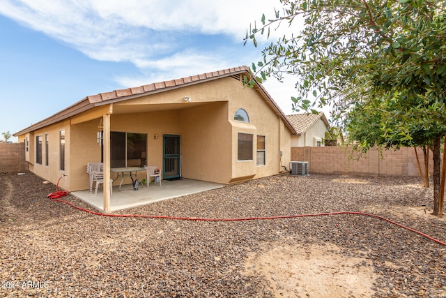 back of property featuring central air condition unit and a patio area