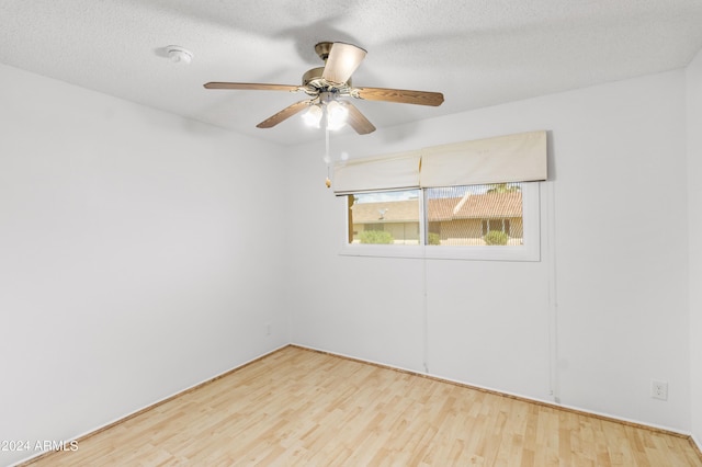 unfurnished room featuring a ceiling fan, a textured ceiling, and wood finished floors