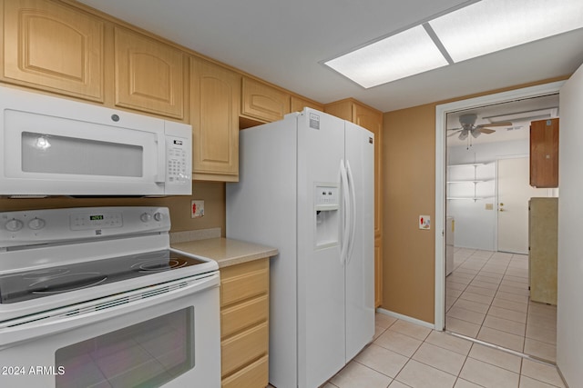 kitchen with ceiling fan, light brown cabinetry, light tile patterned floors, and white appliances