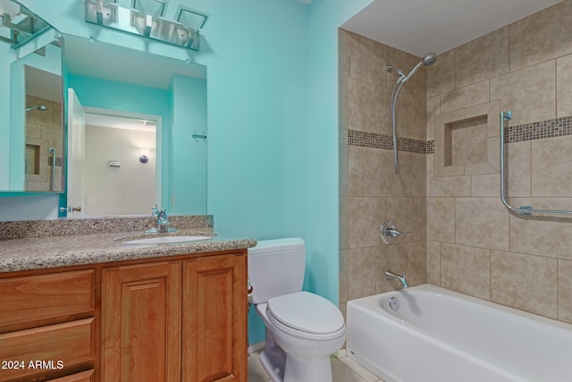 full bathroom with vanity, toilet, and tiled shower / bath combo