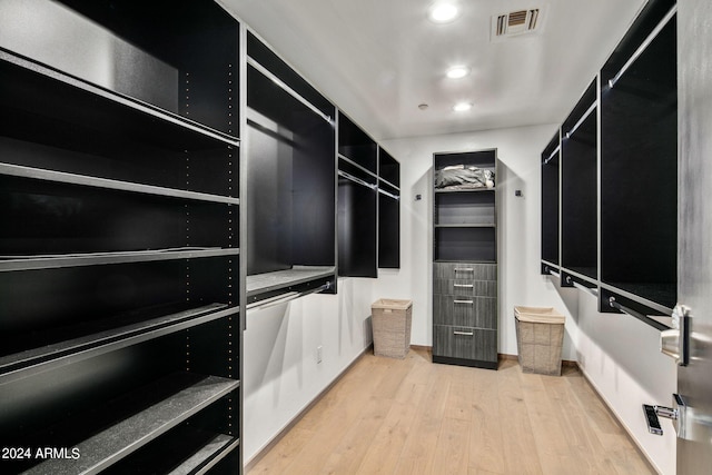 spacious closet featuring light wood-type flooring