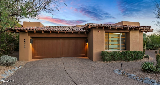 view of front of home with a garage