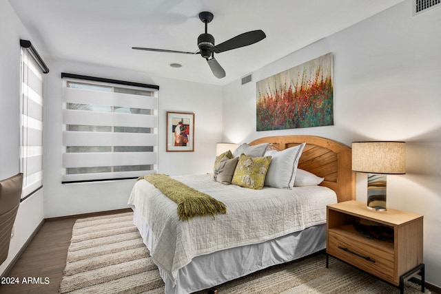 bedroom featuring ceiling fan and dark hardwood / wood-style flooring