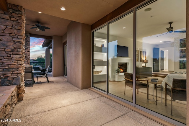 patio terrace at dusk with ceiling fan