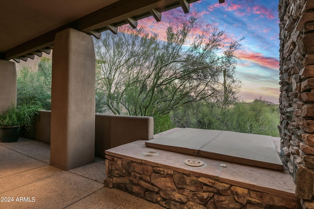 view of patio terrace at dusk