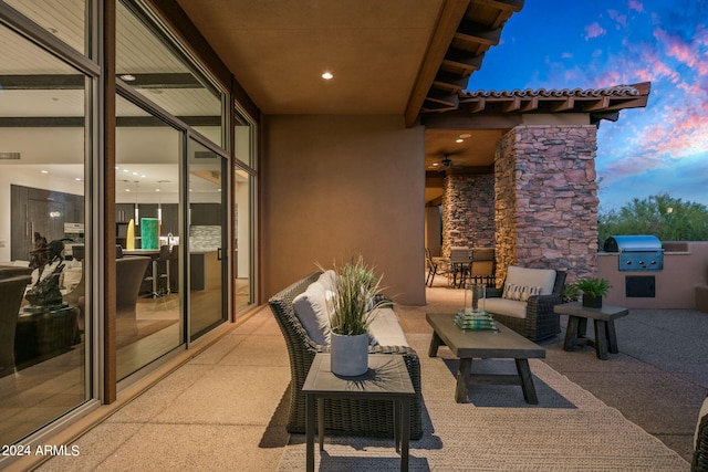 patio terrace at dusk with a grill