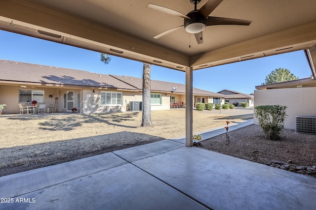 view of patio with central AC and ceiling fan