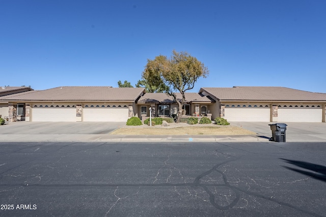 ranch-style home featuring a garage