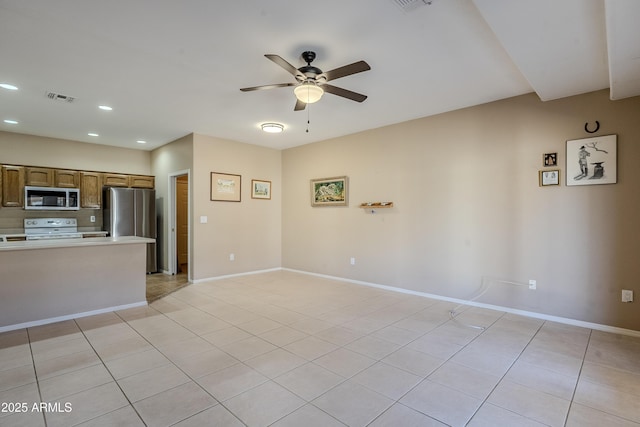 interior space featuring light tile patterned floors and ceiling fan