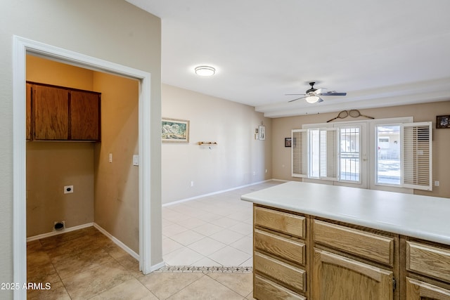 kitchen with light tile patterned floors and ceiling fan