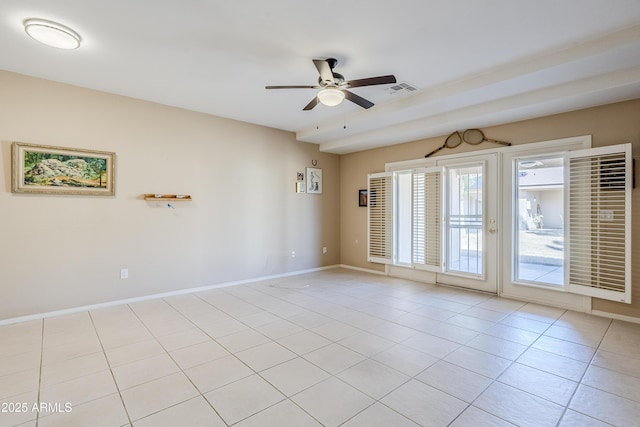 tiled spare room with ceiling fan