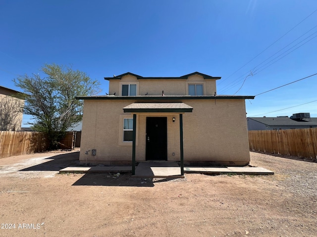 front facade with a patio area