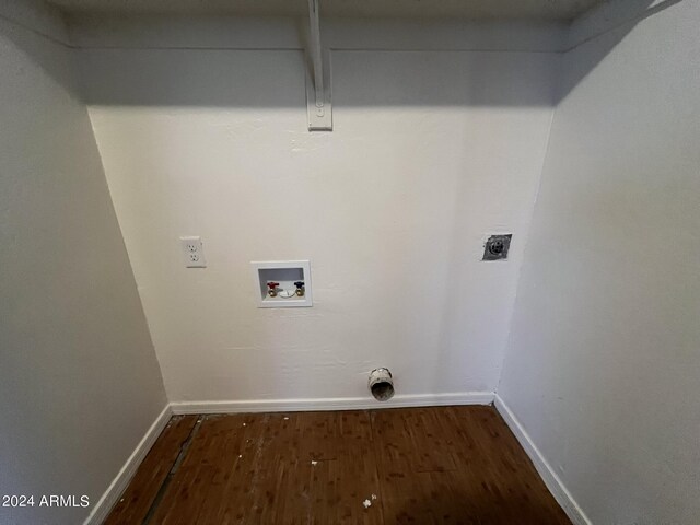 clothes washing area with hookup for a washing machine, hookup for an electric dryer, and dark hardwood / wood-style floors