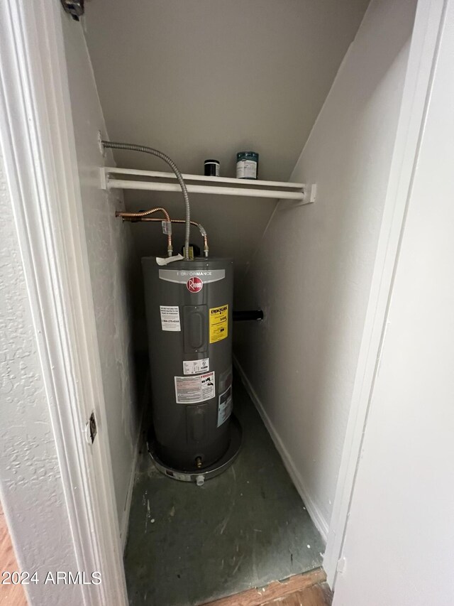 utility room featuring water heater