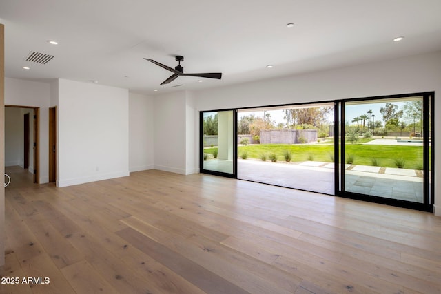spare room with light wood finished floors, a ceiling fan, visible vents, and recessed lighting