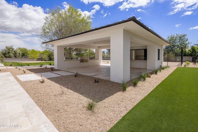 surrounding community with a patio, a yard, fence, and area for grilling