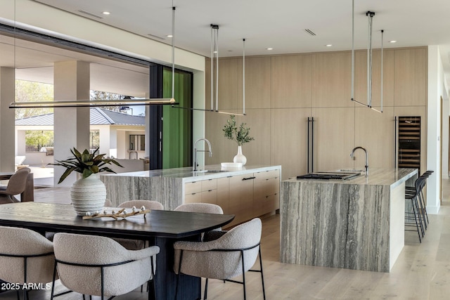 dining area with visible vents, recessed lighting, and light wood-style floors