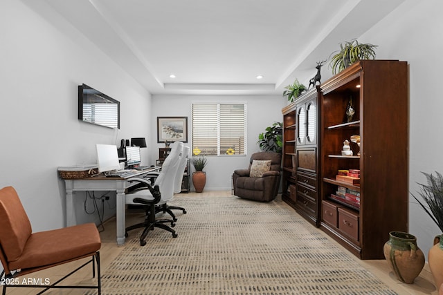office space featuring a raised ceiling and recessed lighting
