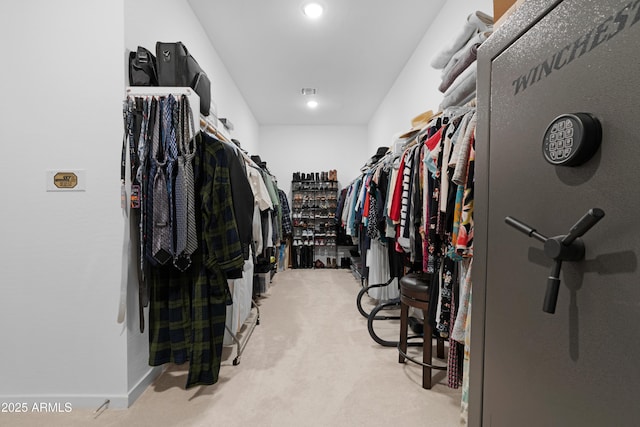 spacious closet with light colored carpet