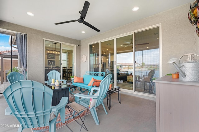 view of patio featuring a ceiling fan and outdoor dining space