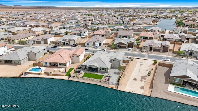 aerial view with a residential view and a water view