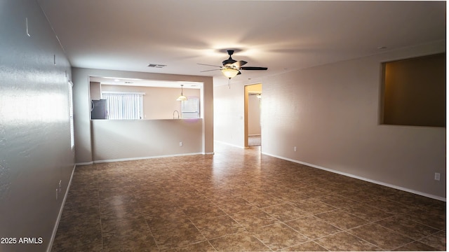 unfurnished room with ceiling fan