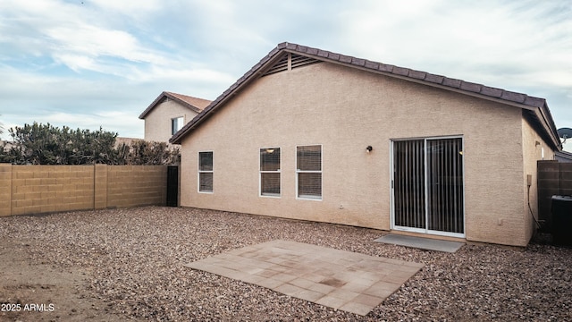 rear view of house featuring a patio