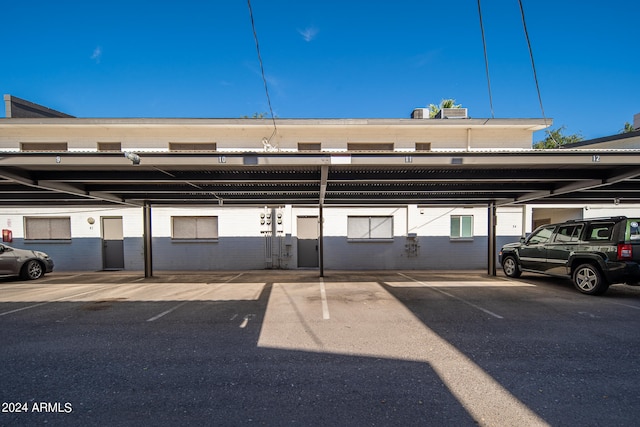 view of parking / parking lot with a carport