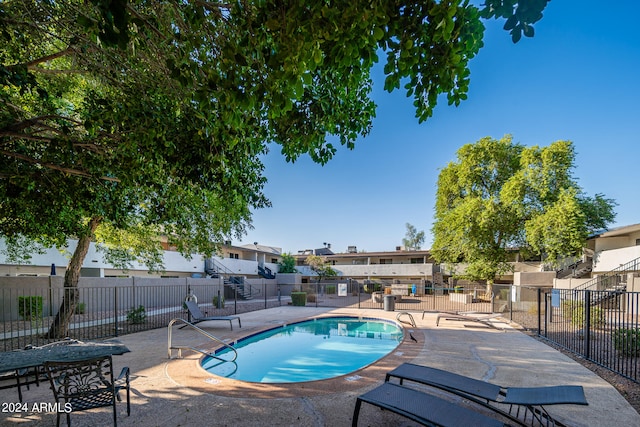 view of swimming pool with a patio