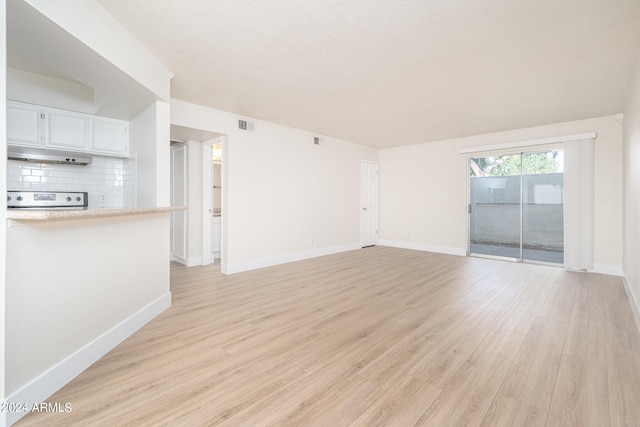 unfurnished living room with light wood-type flooring