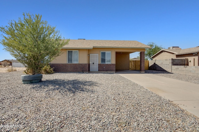 single story home featuring a carport