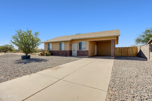 ranch-style house with a carport