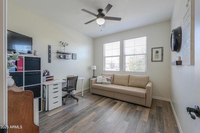 office space with baseboards, wood finished floors, and a ceiling fan