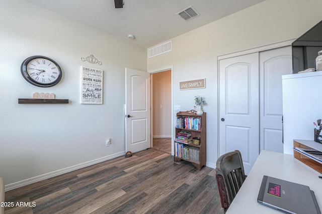 office with visible vents, baseboards, and wood finished floors