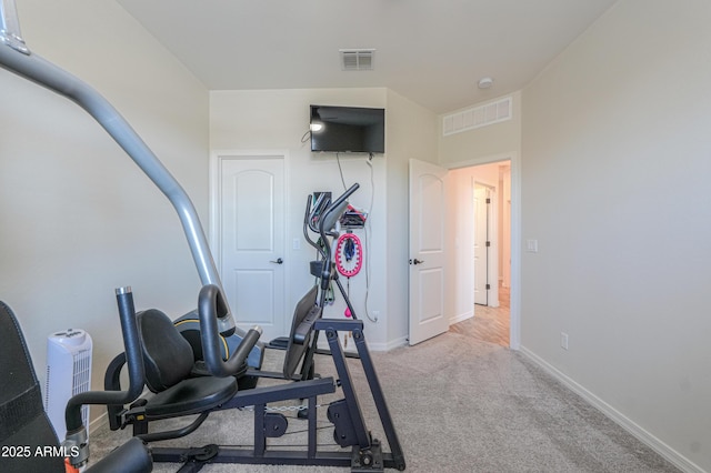 workout area featuring visible vents, carpet flooring, and baseboards