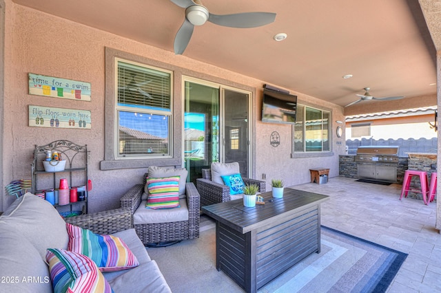 view of patio / terrace with an outdoor hangout area, a ceiling fan, and grilling area