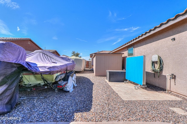 view of yard with an outdoor structure and a shed