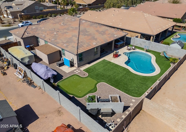 birds eye view of property with a residential view