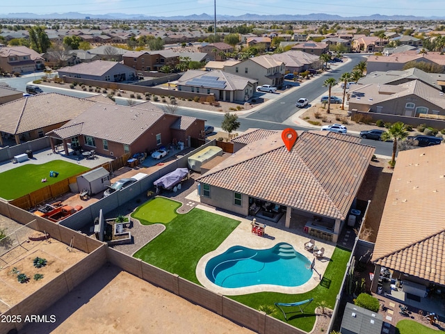 birds eye view of property with a residential view