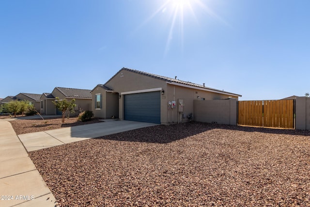 view of side of home with a garage