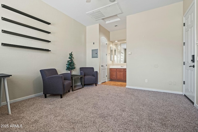 891 W Palo Brea Dr, Litchfield Park, AZ 85340 - living area with electric panel, baseboards, and light colored carpet