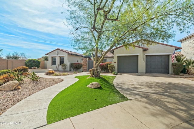 891 W Palo Brea Dr, Litchfield Park, AZ 85340 - view of front of property featuring driveway, stucco siding, an attached garage, a tile roof, and fence