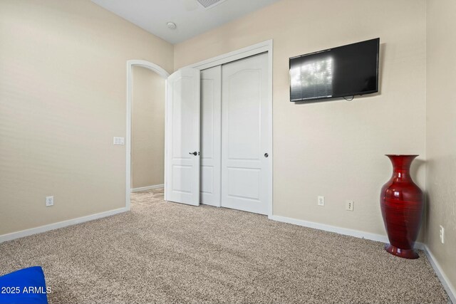 891 W Palo Brea Dr, Litchfield Park, AZ 85340 - unfurnished bedroom featuring baseboards, a closet, visible vents, and carpet floors