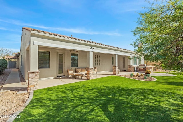 891 W Palo Brea Dr, Litchfield Park, AZ 85340 - back of house with an outdoor hangout area, stucco siding, and a patio