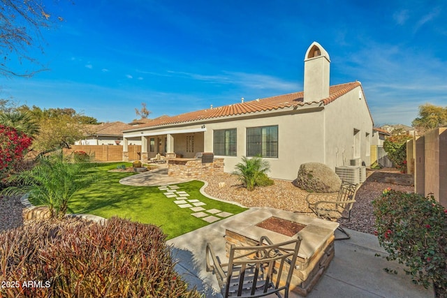 891 W Palo Brea Dr, Litchfield Park, AZ 85340 - back of property with a chimney, stucco siding, a patio, a tile roof, and fence
